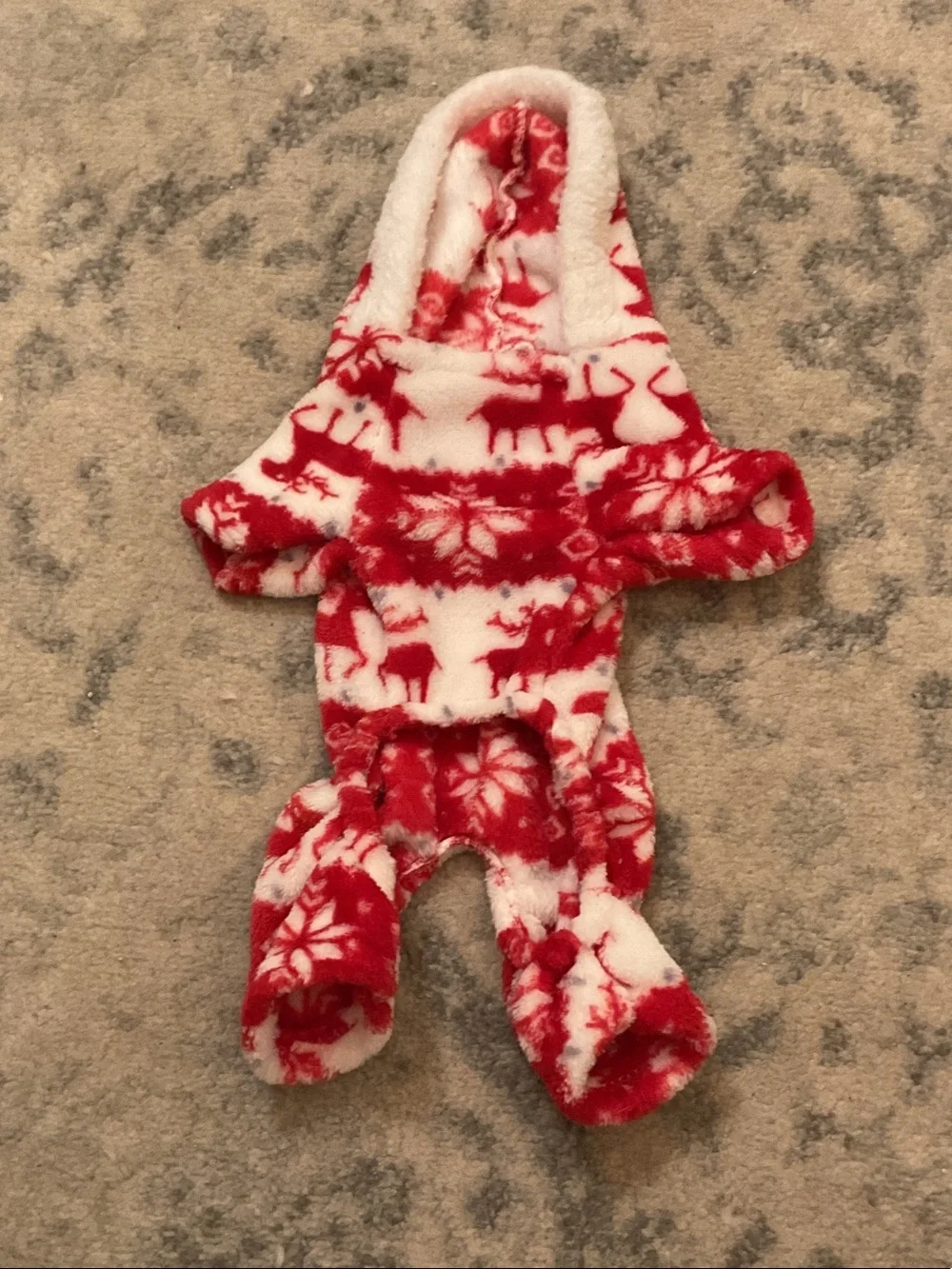 red-and-white fleece reindeer and snowflake dog jumper